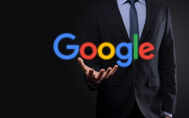 businessman-suit-holds-google-logo